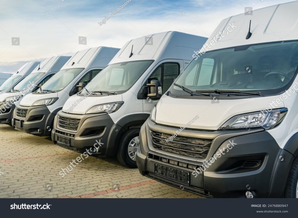 stock-photo-commercial-delivery-vans-parking-in-a-row-transporting-and-shipping-service-company-2476880947