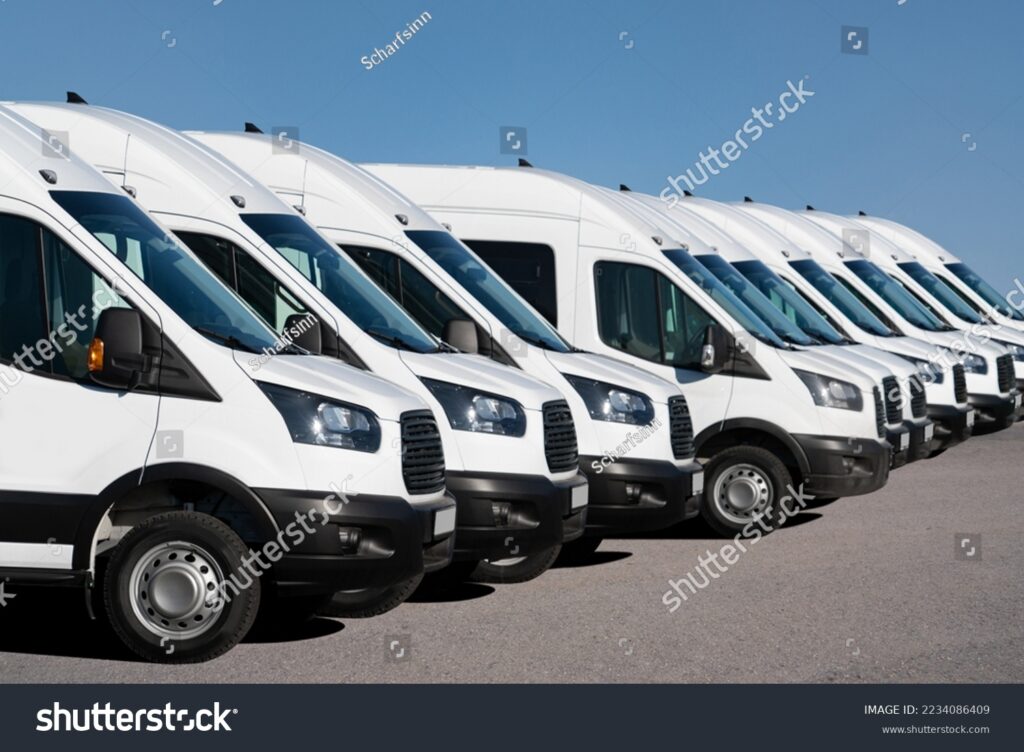 stock-photo-delivery-vans-are-parked-in-rows-commercial-fleet-2234086409