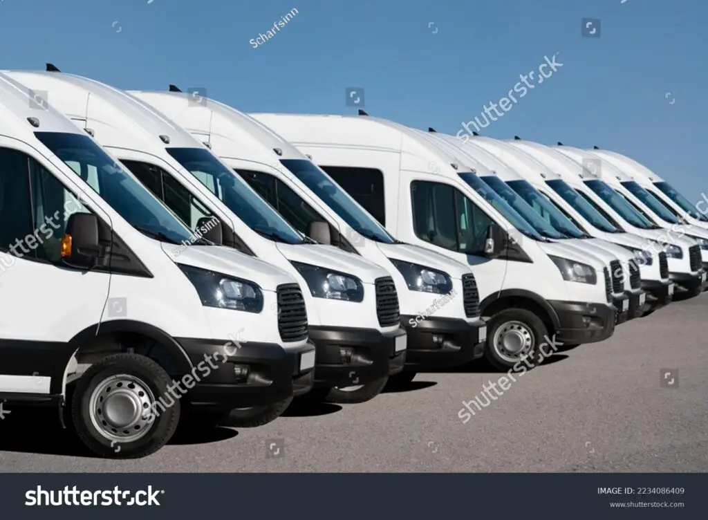 stock-photo-delivery-vans-are-parked-in-rows-commercial-fleet-2234086409