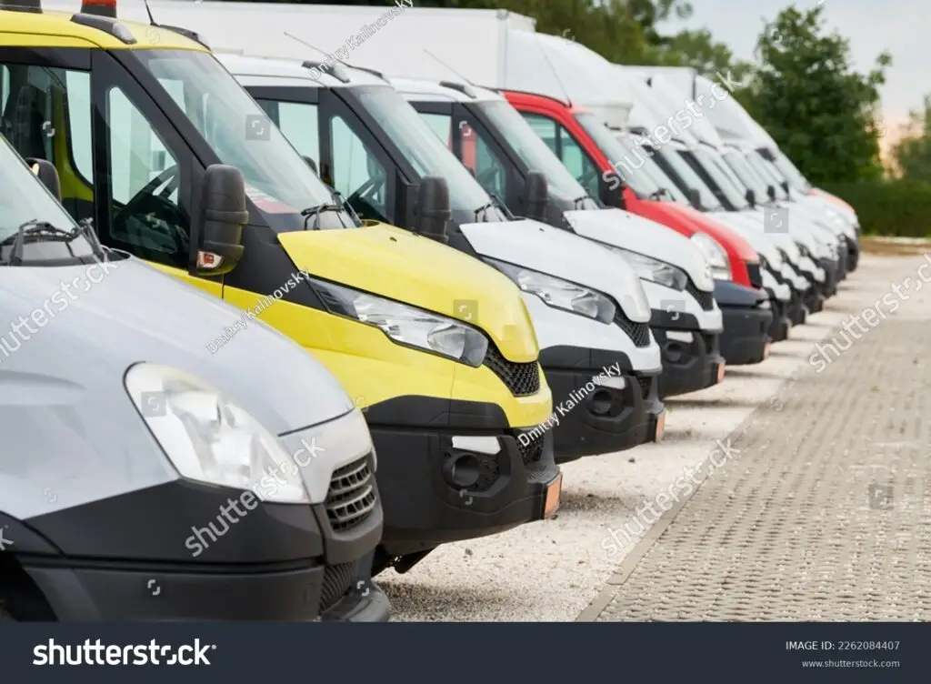 stock-photo-fleet-of-commercial-van-trucks-in-row-logistics-and-transportation-service-company-2262084407